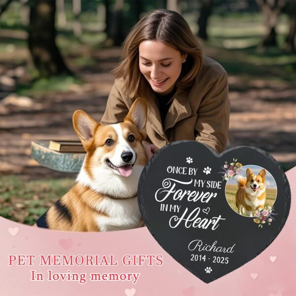 Personalized pet memorial stone gift scene, heart-shaped slate grave marker with photo and "Forever in My Heart" quote, shown with a loving dog owner and her pet, sympathy keepsake for dog and cat loss