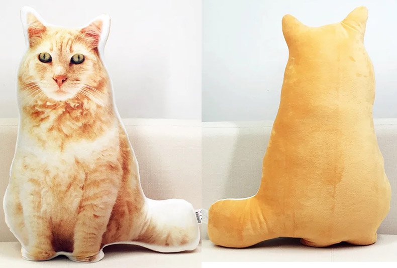 Side view shot of custom orange cat shaped pillow, real cat photo matching plush memory cushion back outline, personalized pet portrait throw pillow for cat loss memorial keepsake